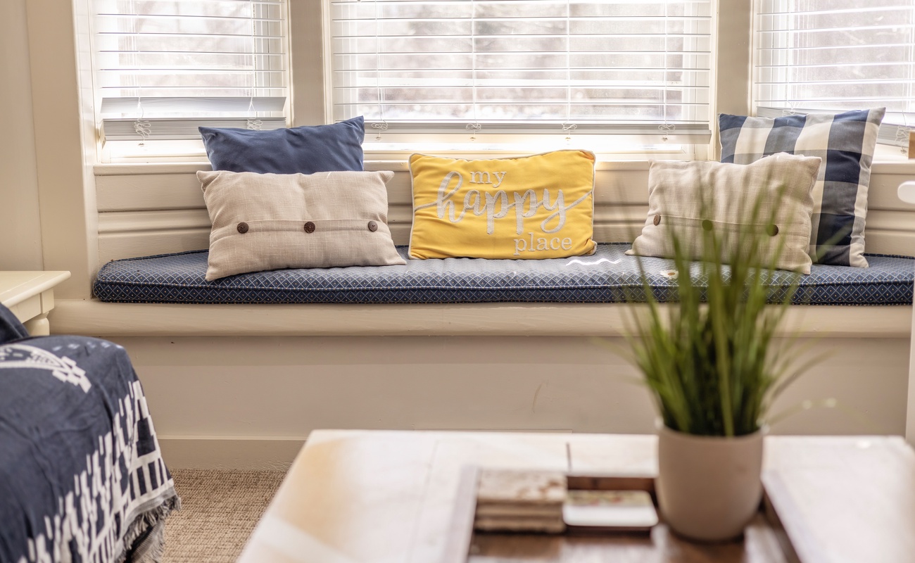 Charming window seat with views of the yard
