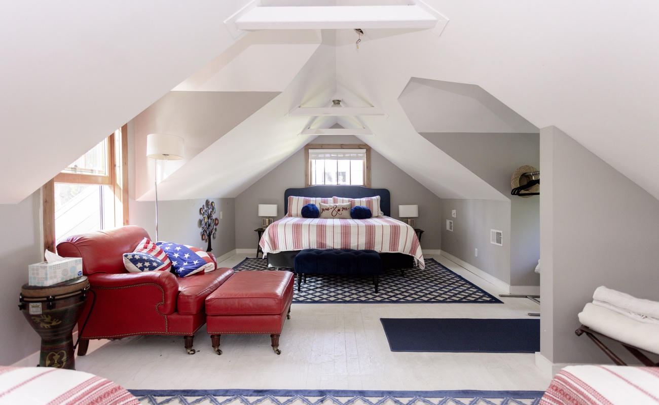 Cozy King bed in the sleeping area upstairs