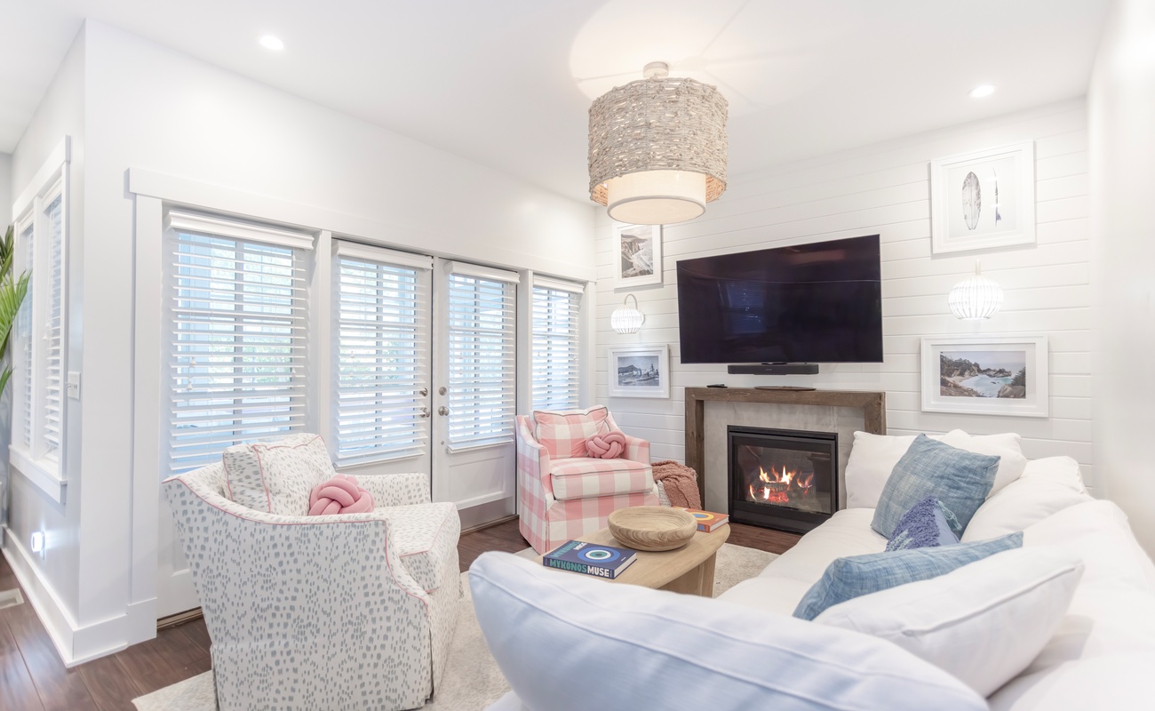 Cozy living area off the kitchen with fireplace and TV