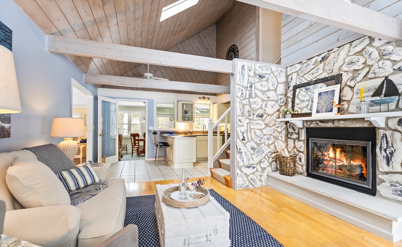 The living area offers views of the dining room, creating an open and connected space.