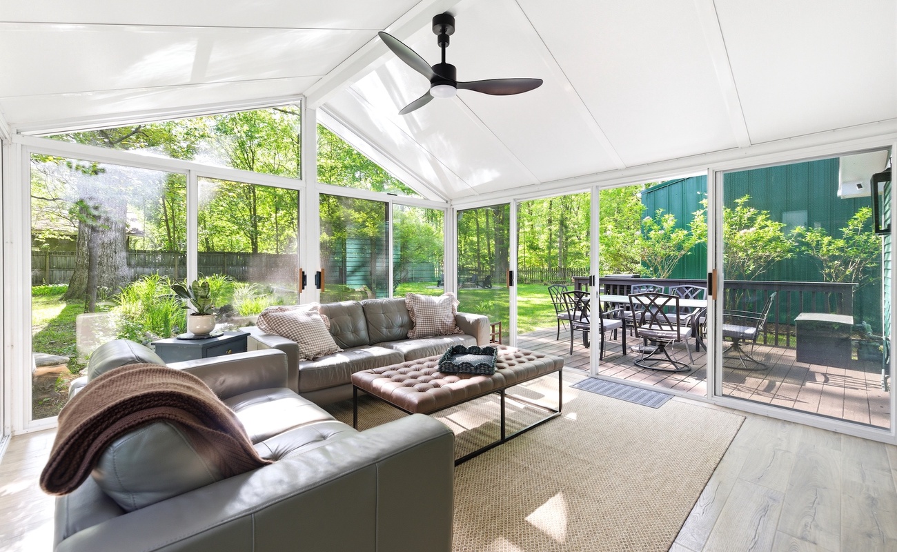 Screened in porch area opens to deck