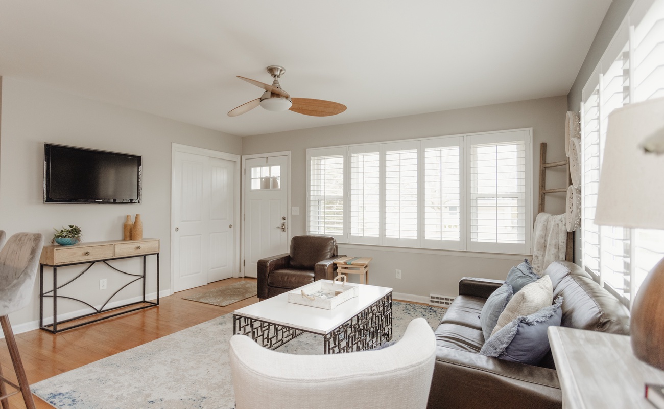 Upstairs living area with TV and seating