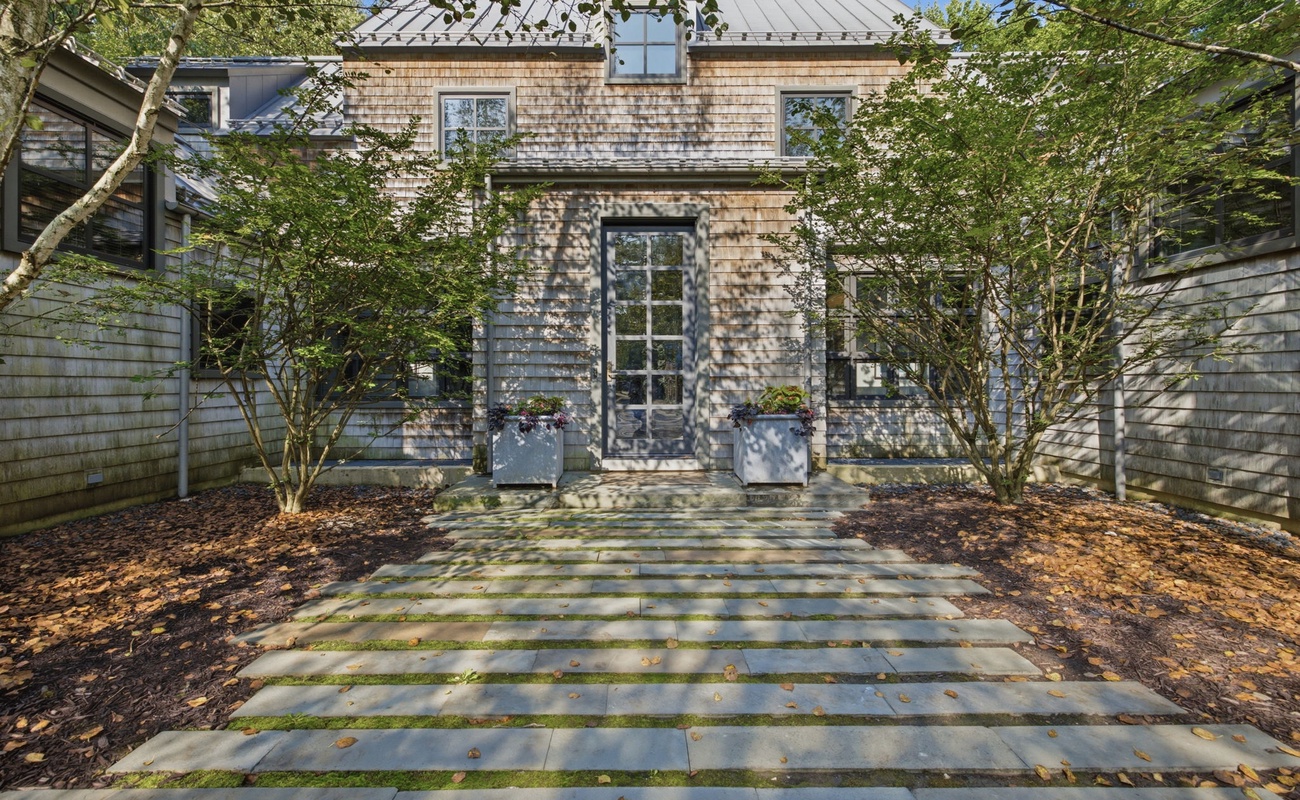 Welcoming Front Entry with Natural Cedar Shingles and Lush Landscaping