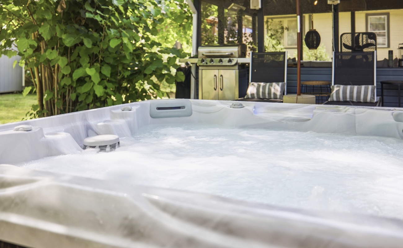 Unwind in the private hot tub after a day at the beach, then gather around the grill and screened porch for an evening that feels like summer.