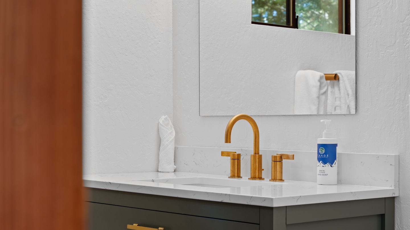 Refresh in your elegantly designed bathroom with polished finishes, gleaming gold fixtures, and thoughtful amenities that make every moment feel special.