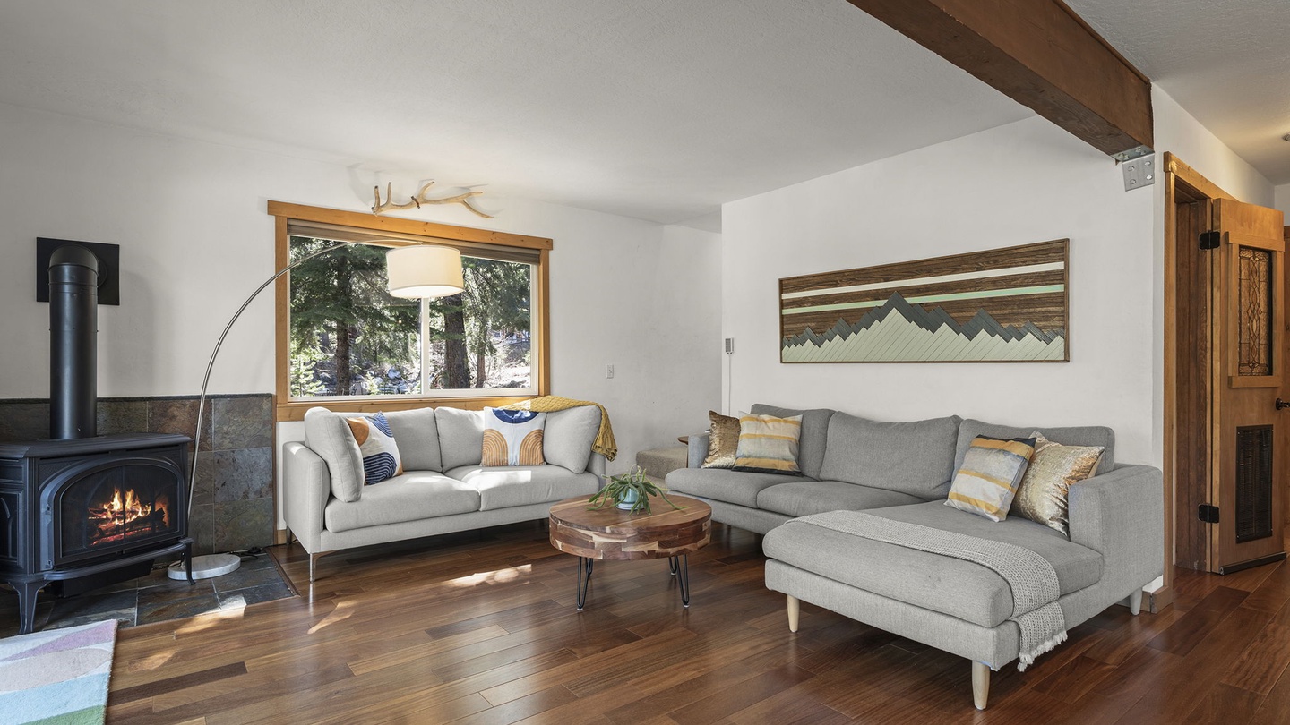 Cozy up by your private fireplace while soaking in mountain views through expansive windows in this beautifully appointed living space.