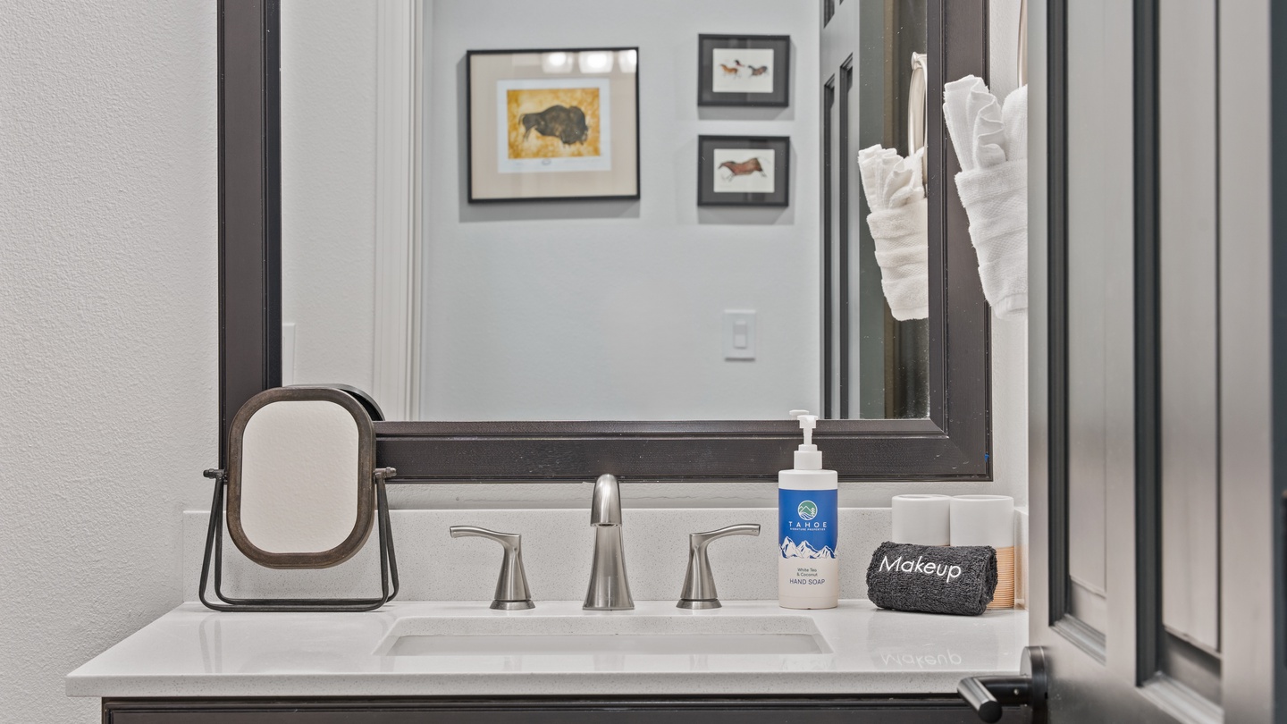 Freshen up in your thoughtfully appointed bathroom with a clean vanity, modern fixtures, and fluffy white towels at the ready—a bright, inviting space that makes it easy to get ready for whatever your day holds.
