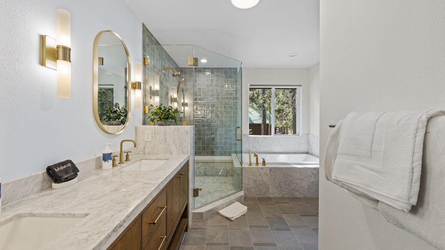 Step into your private spa retreat, where elegant marble countertops, soft designer lighting, and a luxurious soaking tub await. Plush towels and a walk-in shower with chic tiling make every moment feel indulgent.