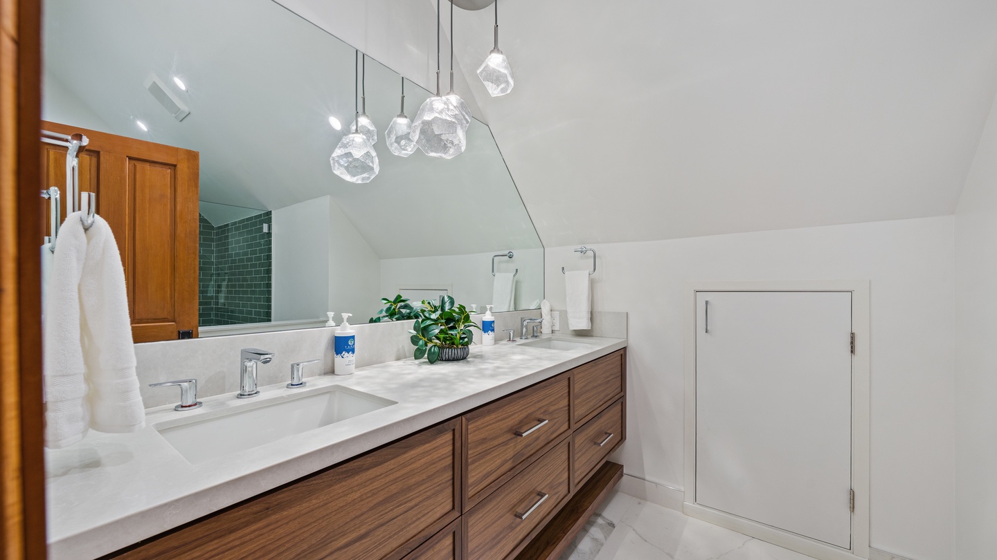 Step into your serene bathroom retreat, where soft lighting and elegant marble counters create the perfect space to unwind after a day of adventure.