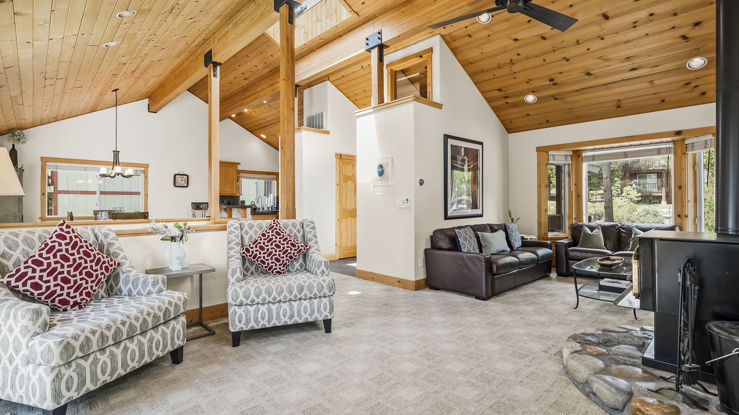 Living Room with wood-burning fireplace, and rustic river-rock hearth