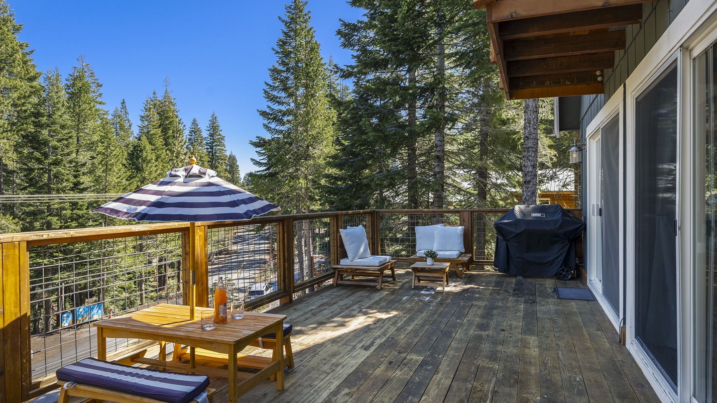 Step onto your private deck where towering pines create a peaceful forest sanctuary, complete with outdoor dining and BBQ for memorable meals.