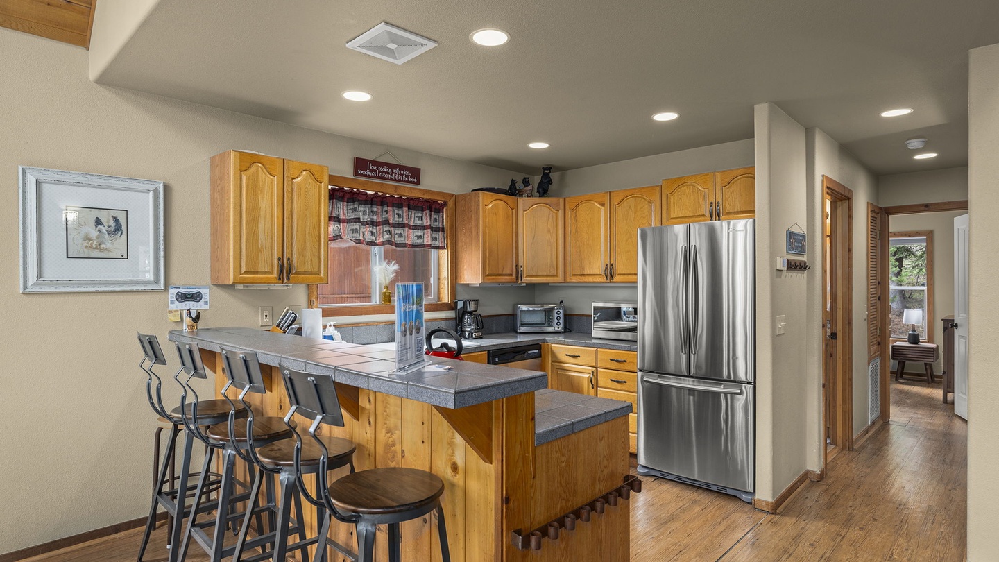 Gather around this spacious kitchen island where your group can cook together and share stories over morning coffee or evening wine.
