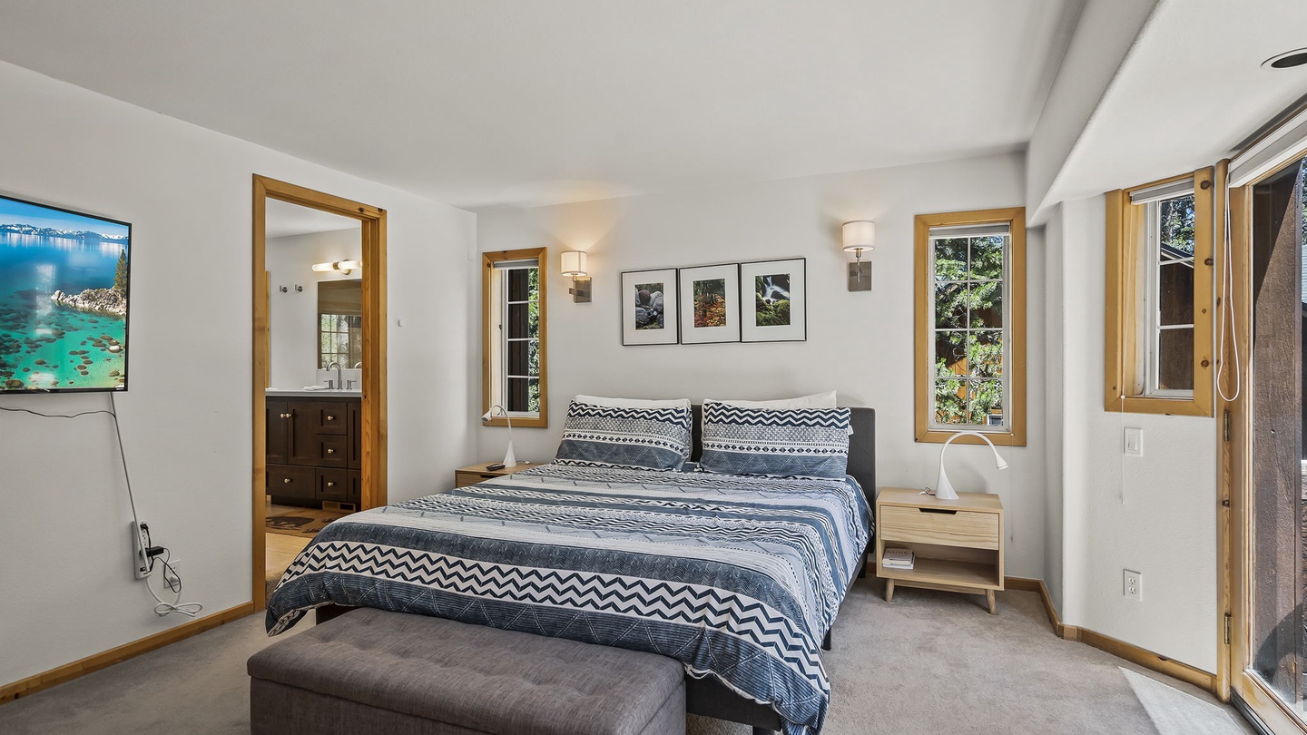 Sink into the plush bedding and wake to soft natural light spilling through tall windows. Your private en-suite awaits, and stylish artwork creates a serene retreat.