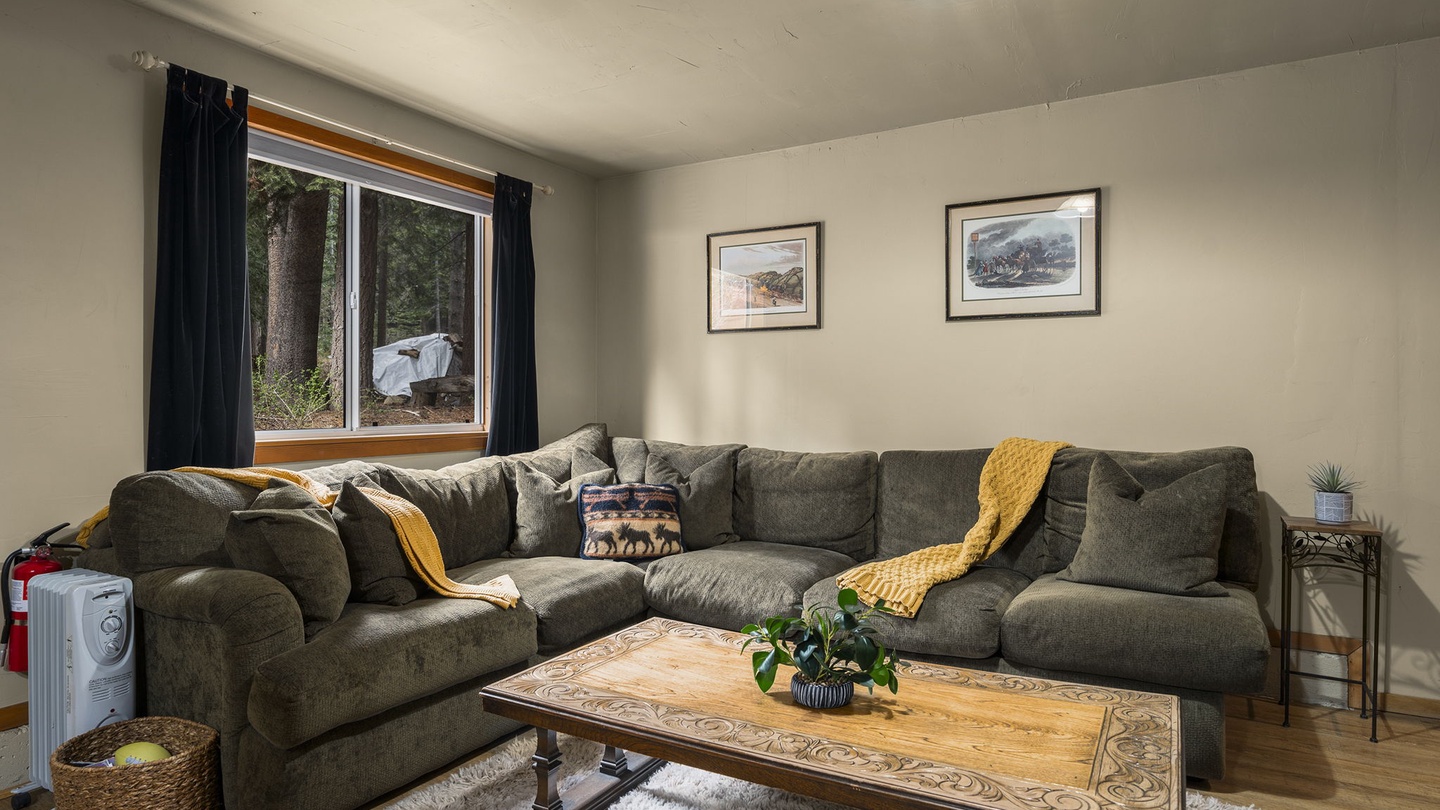 Sink into this cozy sectional where golden throws invite you to unwind after adventure-filled days exploring the natural surroundings.