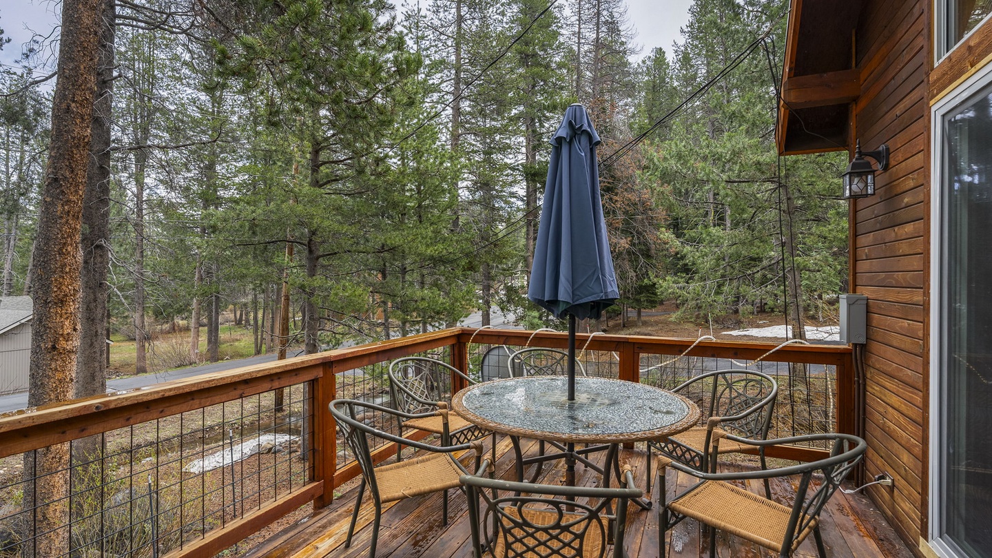 Step onto your private deck and breathe in the fresh mountain air while enjoying meals surrounded by towering pine trees.