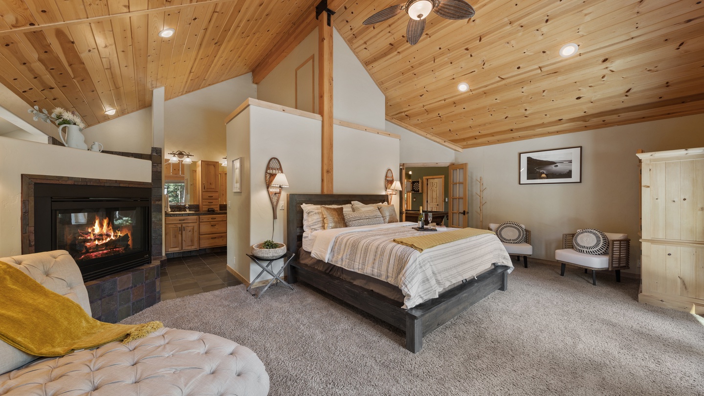 Unwind in your spacious retreat with vaulted wood ceilings and a cozy fireplace that sets the perfect mood for relaxation after a day of adventure.