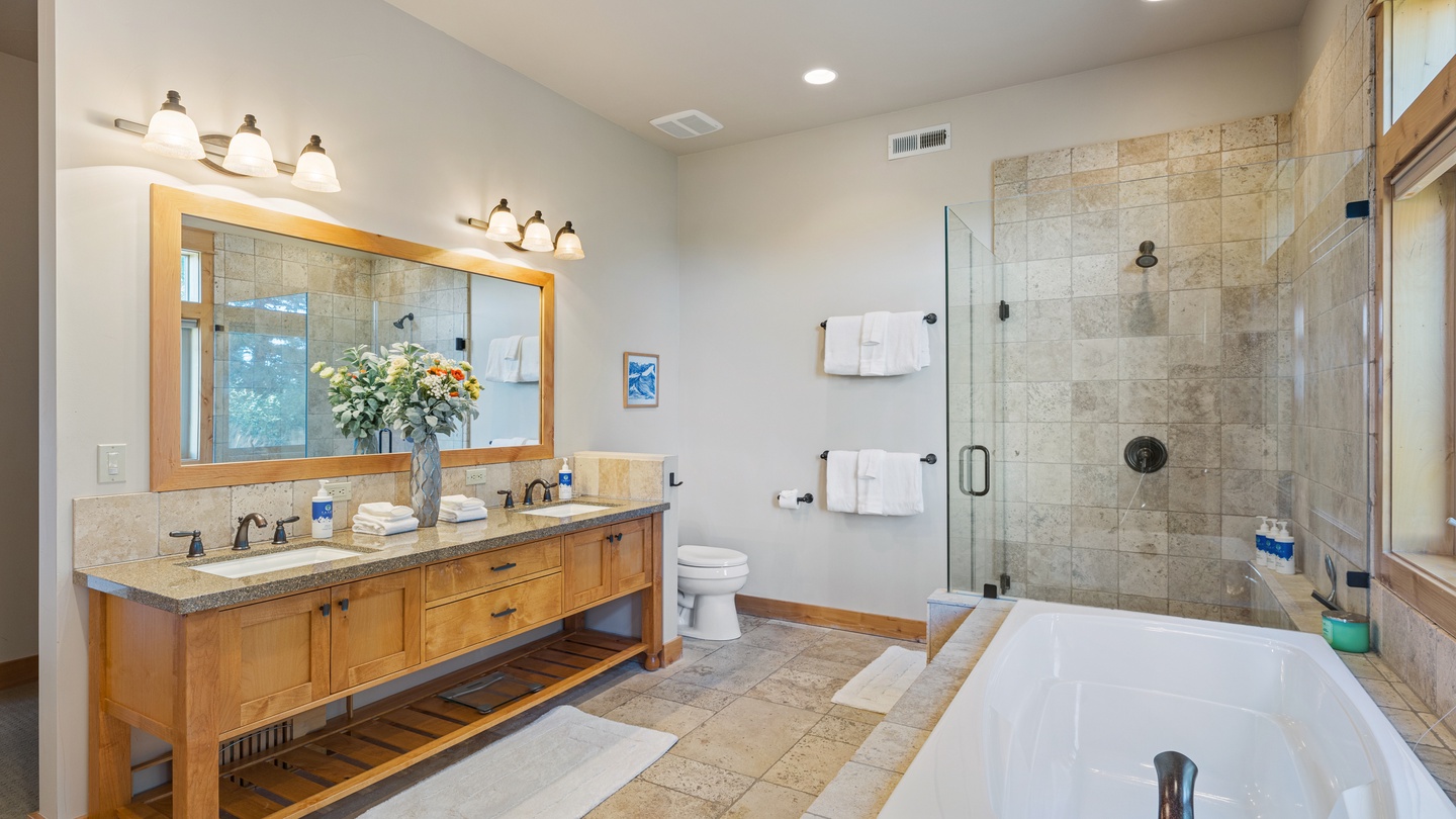 Step into your private spa-like retreat with a luxurious soaking tub, spacious walk-in shower, and elegant dual vanities. Everything you need to unwind and refresh after a day of adventure.