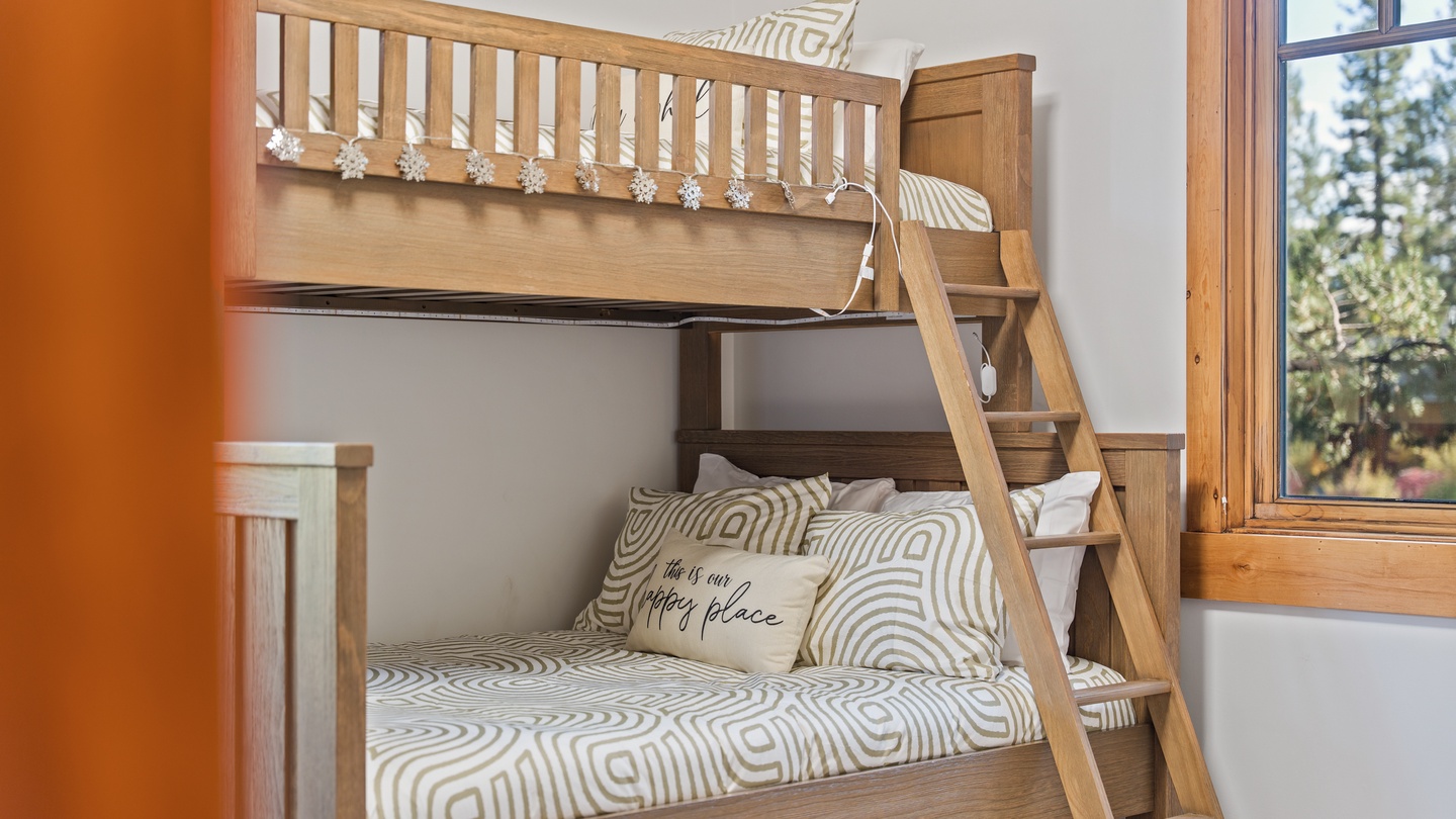 Your kids will love claiming their favorite bunk in this cozy sleeping space, where cheerful decor and natural light create a welcoming retreat for rest and play.