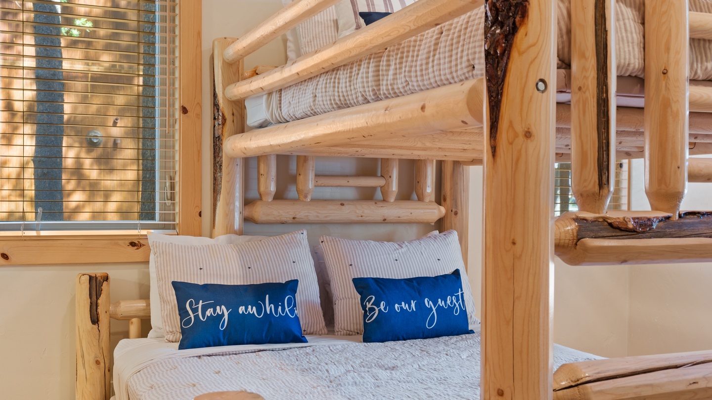 Rustic log bunk beds create a cozy, cabin-style retreat for your family. Each bed is thoughtfully dressed with soft linens and welcoming pillows, perfect for restful nights after a day of adventure.