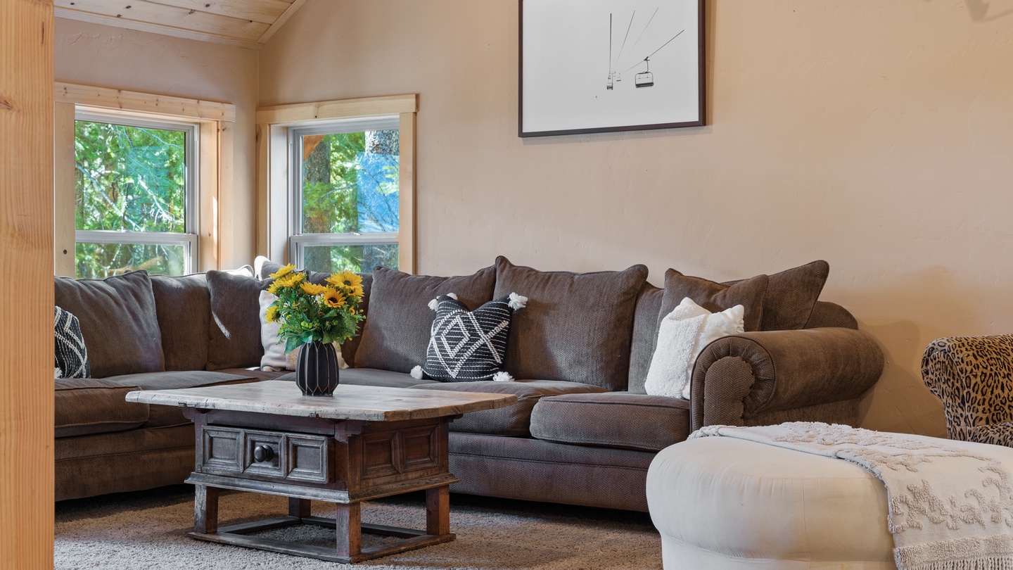 Sink into plush seating and let natural light fill your comfortable living space, where rustic charm meets modern relaxation.