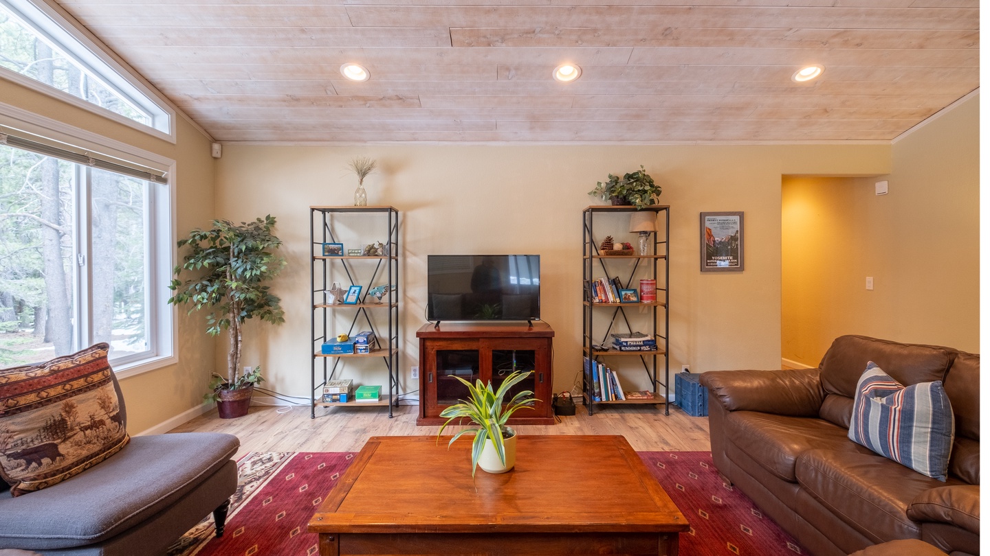 Living Room w/ Entertainment Center: Three Pines Family Cabin