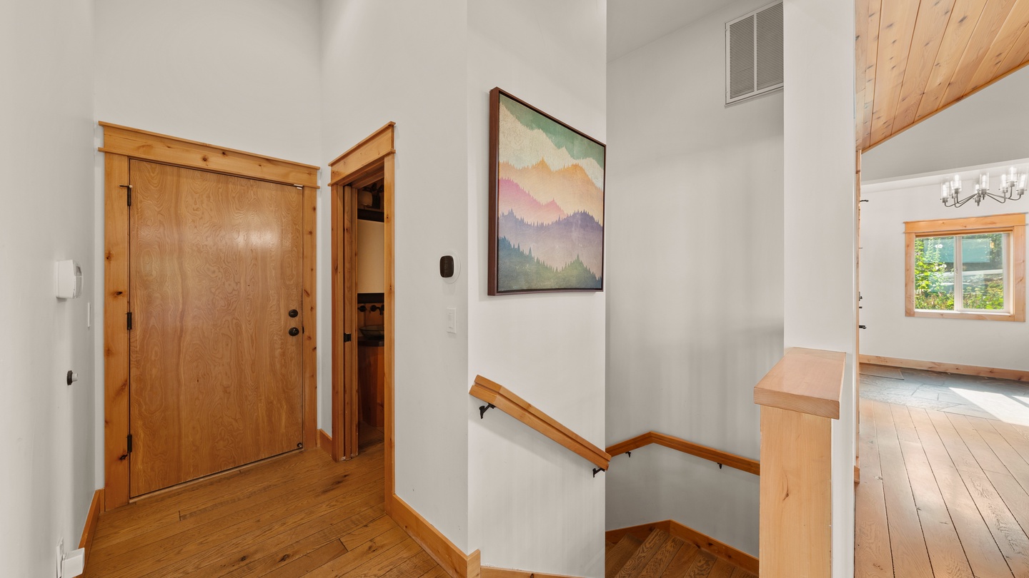 Step inside to find warm wood accents and vaulted ceilings that create an inviting mountain retreat atmosphere from the moment you arrive.