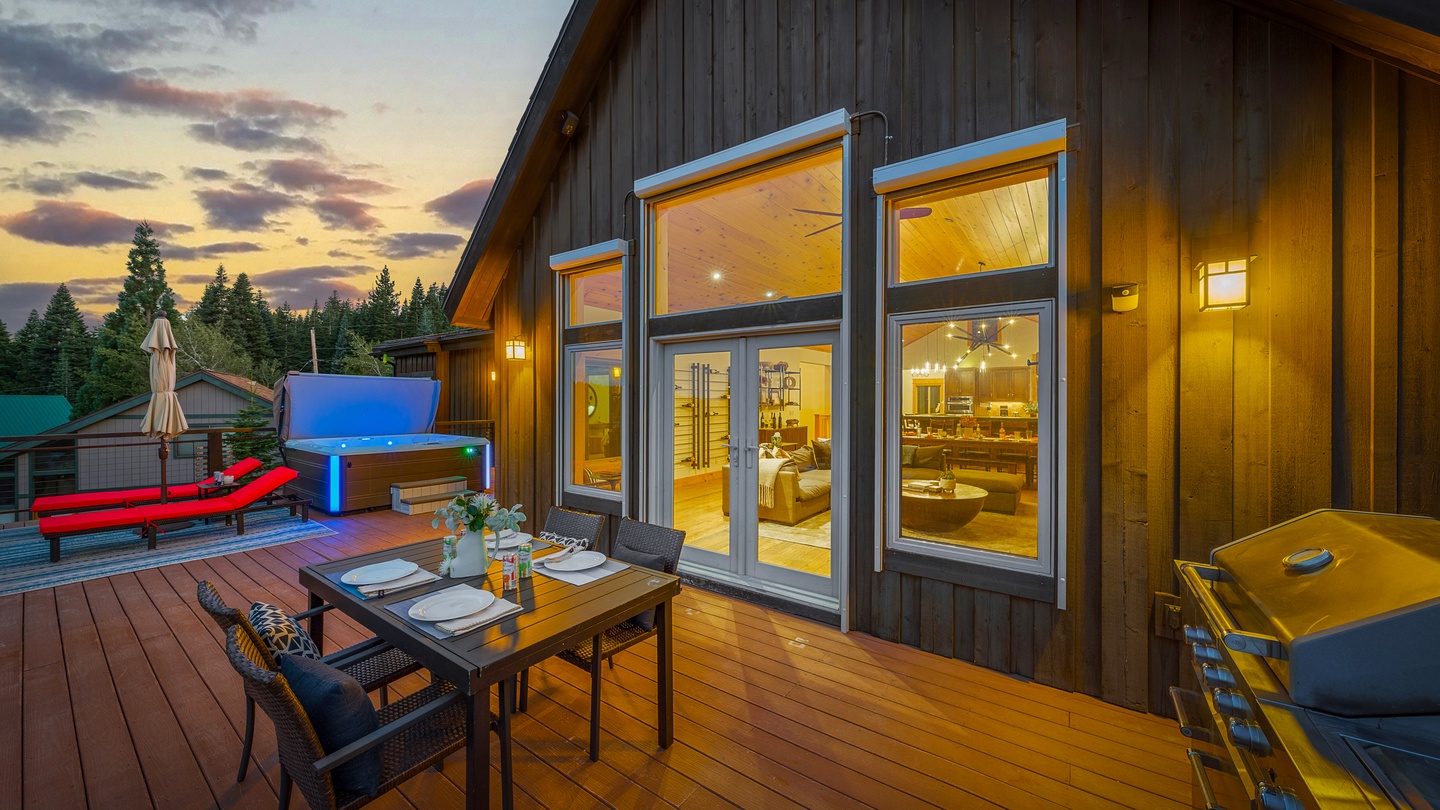 Your private deck glows as the sun dips behind the pines, offering the perfect spot for an evening meal by the grill or a soak in your hot tub under the stars.