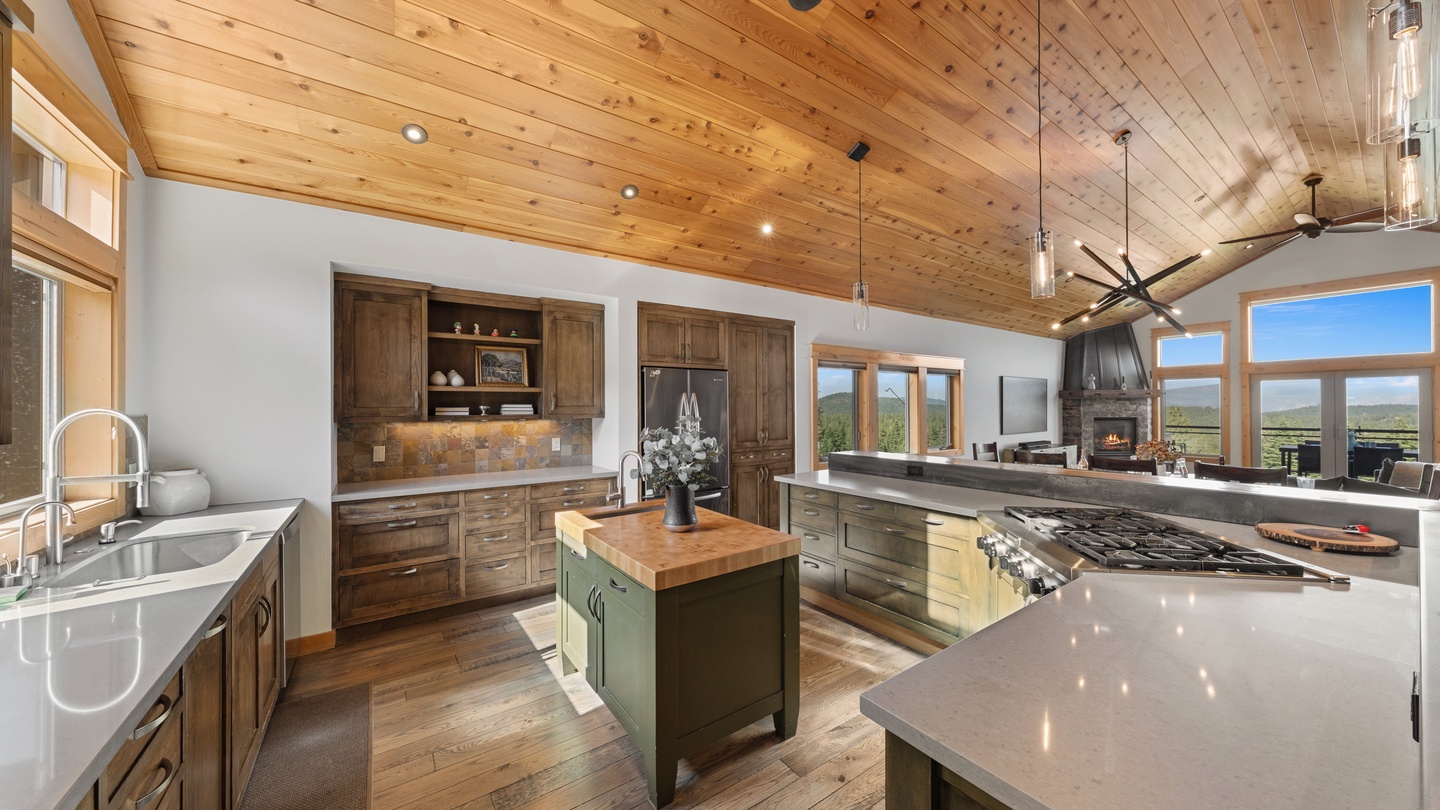 Open kitchen with warm wood finishes and ample counter space.