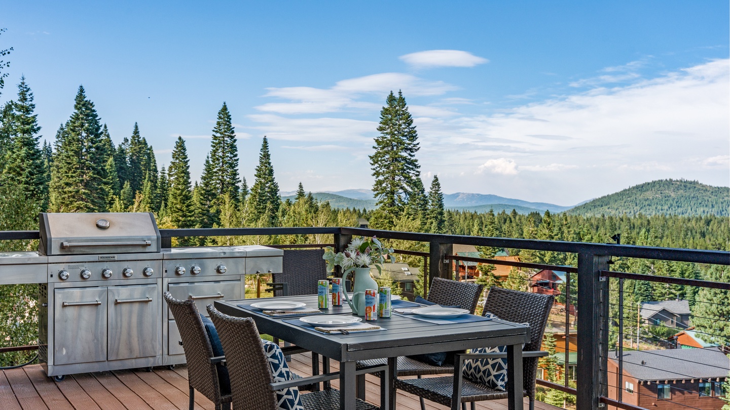 The property is nestled among evergreen forests with mountain views visible in the surrounding area, offering a peaceful natural setting for your stay.