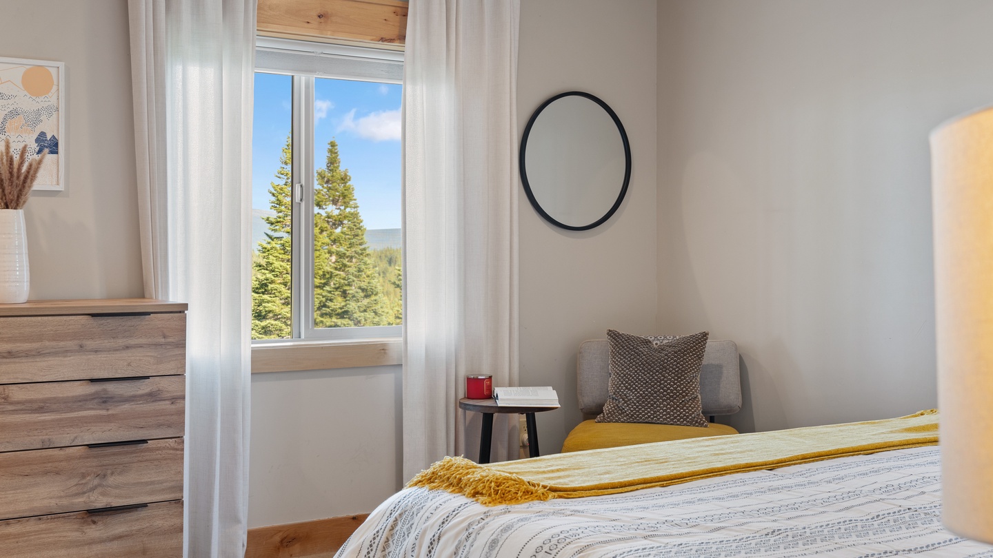 Wake up each morning to views of evergreen forests and mountain ridges framed by your bedroom window. Soft linens and peaceful décor help you unwind after exploring nearby trails.