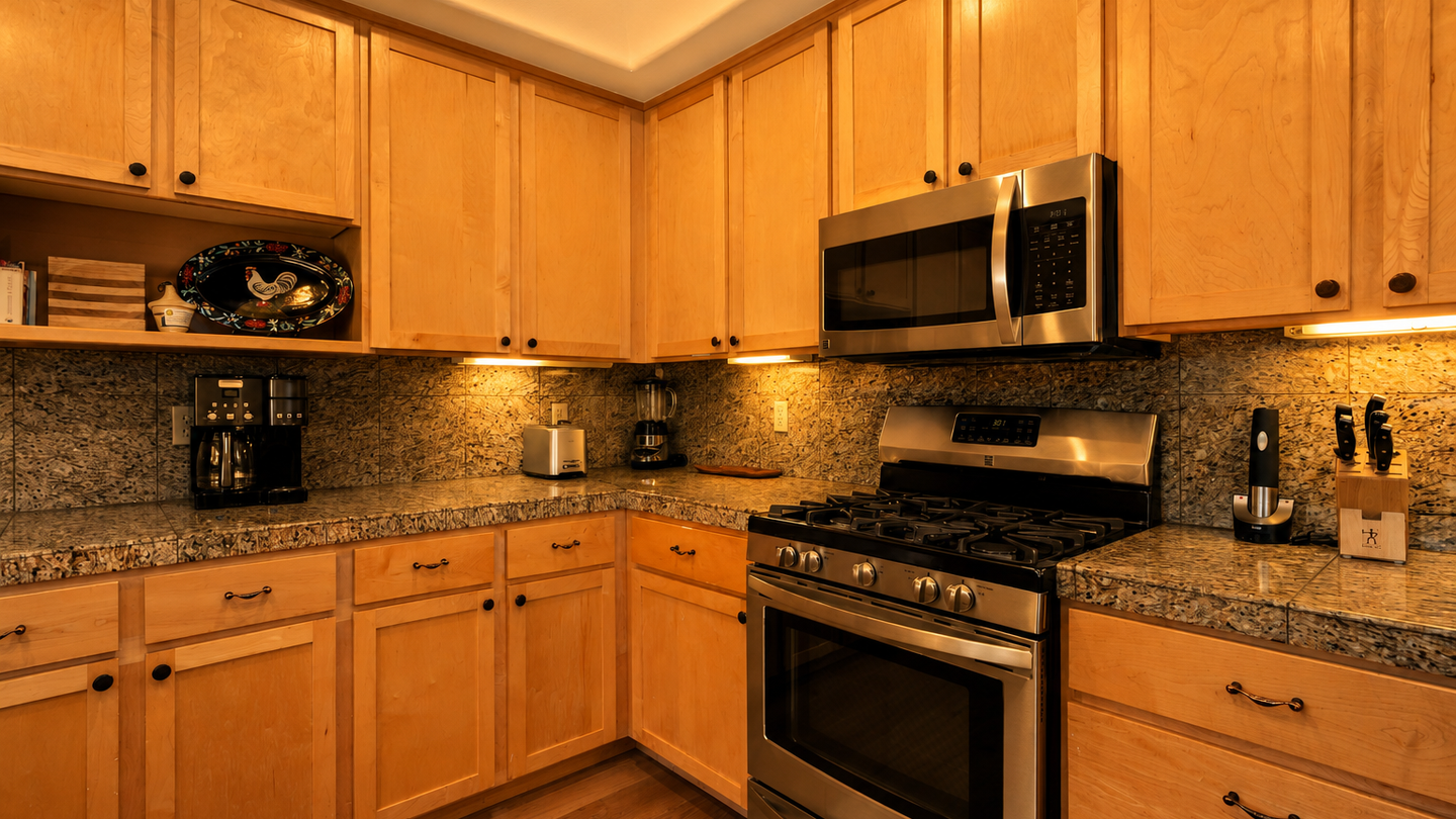 Your fully-equipped kitchen features granite countertops, stainless steel appliances, and ample storage—everything you need to cook your favorite meals or enjoy morning coffee in comfort.
