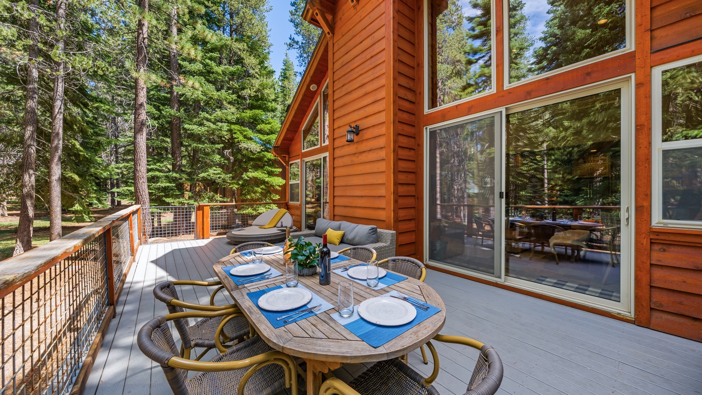 Your private deck is ready for open-air meals surrounded by towering pines, with plenty of space to lounge, dine, and soak up the fresh mountain atmosphere.