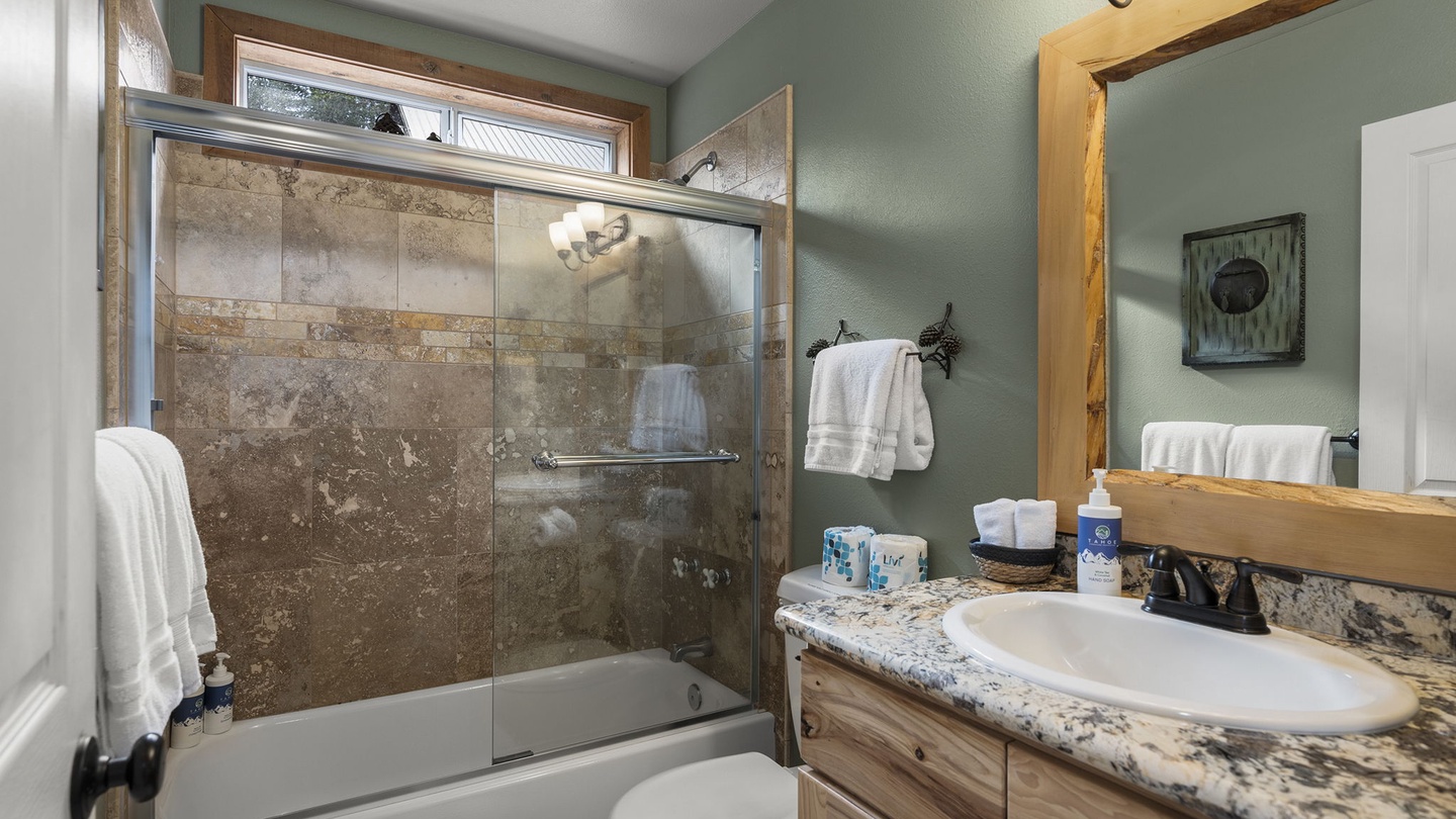 Unwind in your beautifully appointed bathroom with luxurious granite countertops, walk-in shower, and fluffy towels awaiting your arrival.