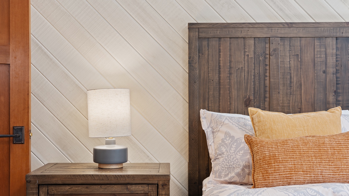 Drift off in a cozy space where rustic wood and warm tones create your perfect retreat.