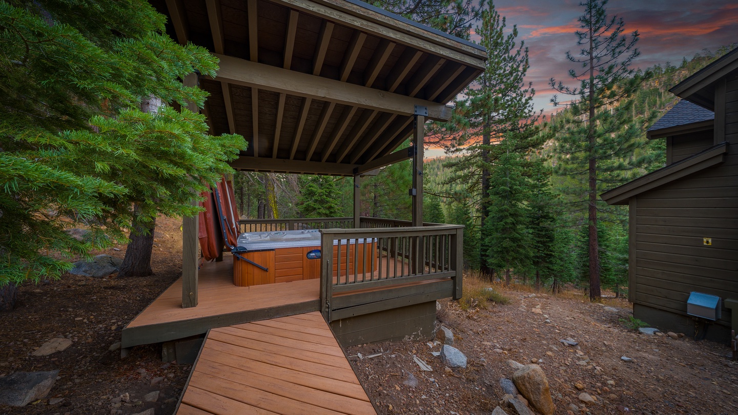 Soak under the stars in your private hot tub, framed by towering pines and painted evening skies—pure mountain magic awaits.