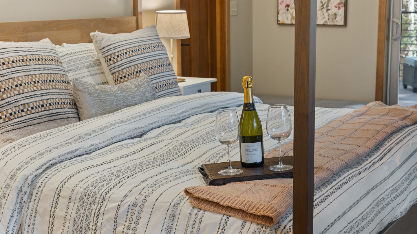 Slip into cozy bedding and uncork a bottle of bubbly—your restful escape awaits with soft linens, warm touches, and a welcoming retreat designed just for you.