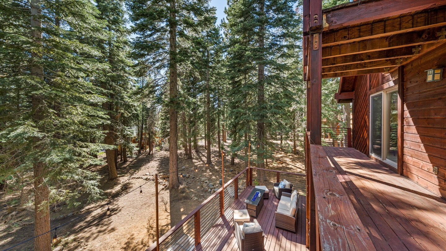 A peaceful, elevated sanctuary surrounded by towering pines—your balcony offers a quiet forest retreat where morning coffee tastes better and afternoon breezes feel refreshing.