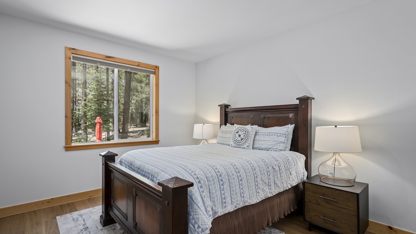 Wake up to serene forest views from your peaceful bedroom retreat. Soft lighting and mountain air promise restful nights after days exploring nature.