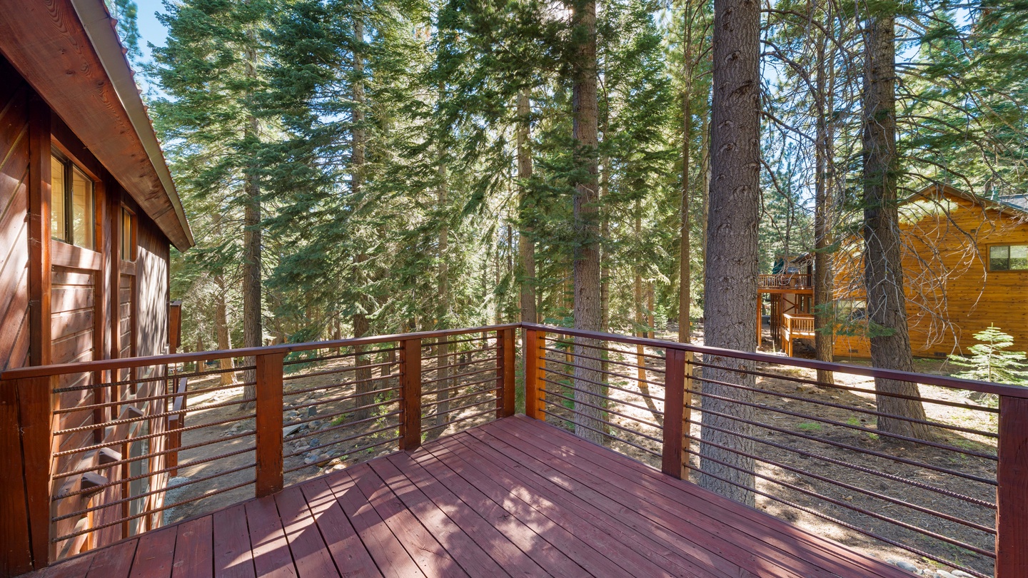 Step outside onto your private deck and breathe in the crisp mountain air, surrounded by towering pines. The peaceful forest setting creates the perfect backdrop for morning coffee or evening relaxation.