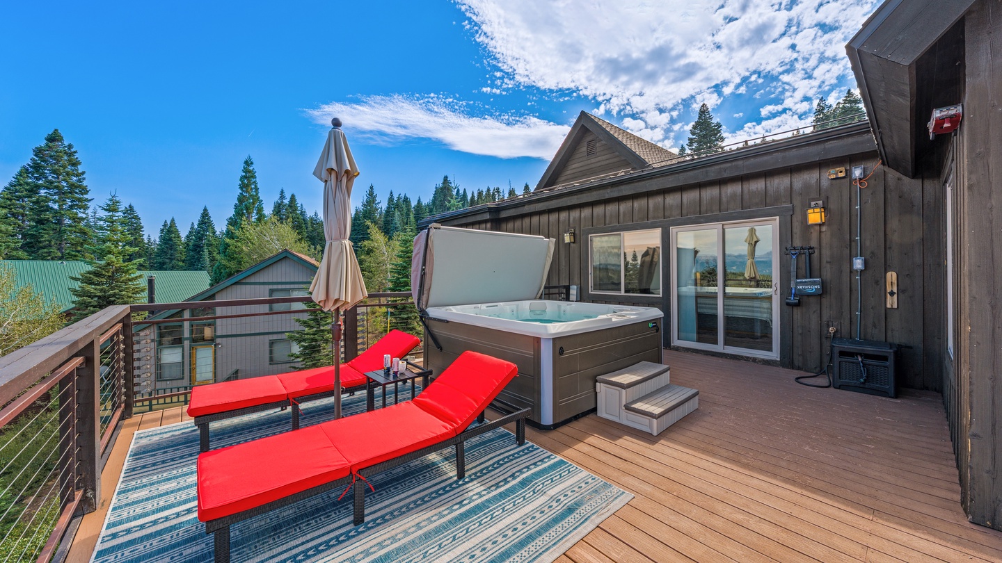 Unwind on your private deck with a soothing soak in the hot tub, then lounge on the sun-drenched terrace while taking in the towering pines and mountain air.
