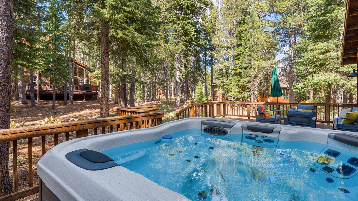 Soak your cares away in this inviting hot tub while towering pines surround you and the deck spreads into your own tranquil forest retreat.
