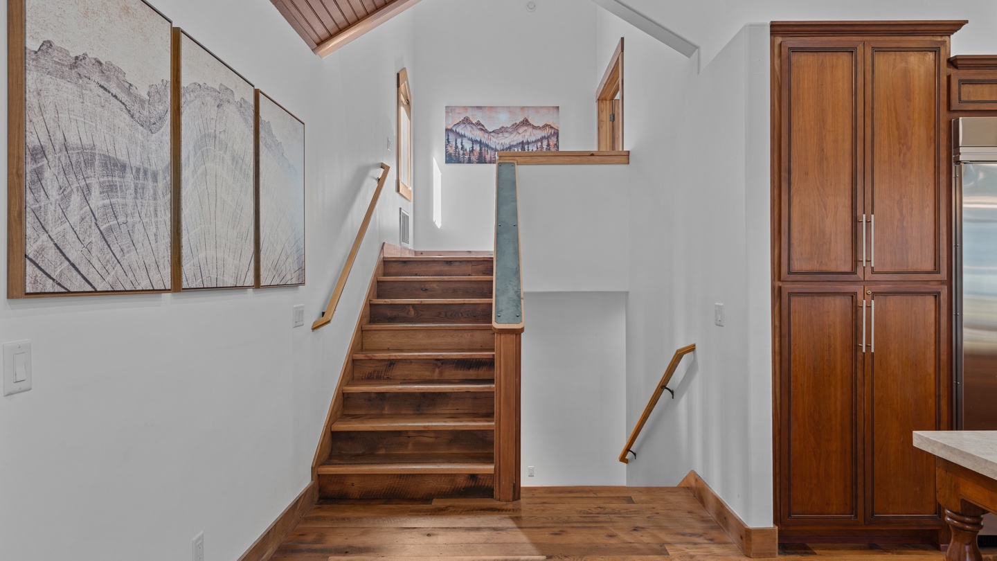 Warm wood accents and vaulted skylights greet you at the entrance, blending mountain-inspired art with thoughtful craftsmanship throughout this welcoming space.