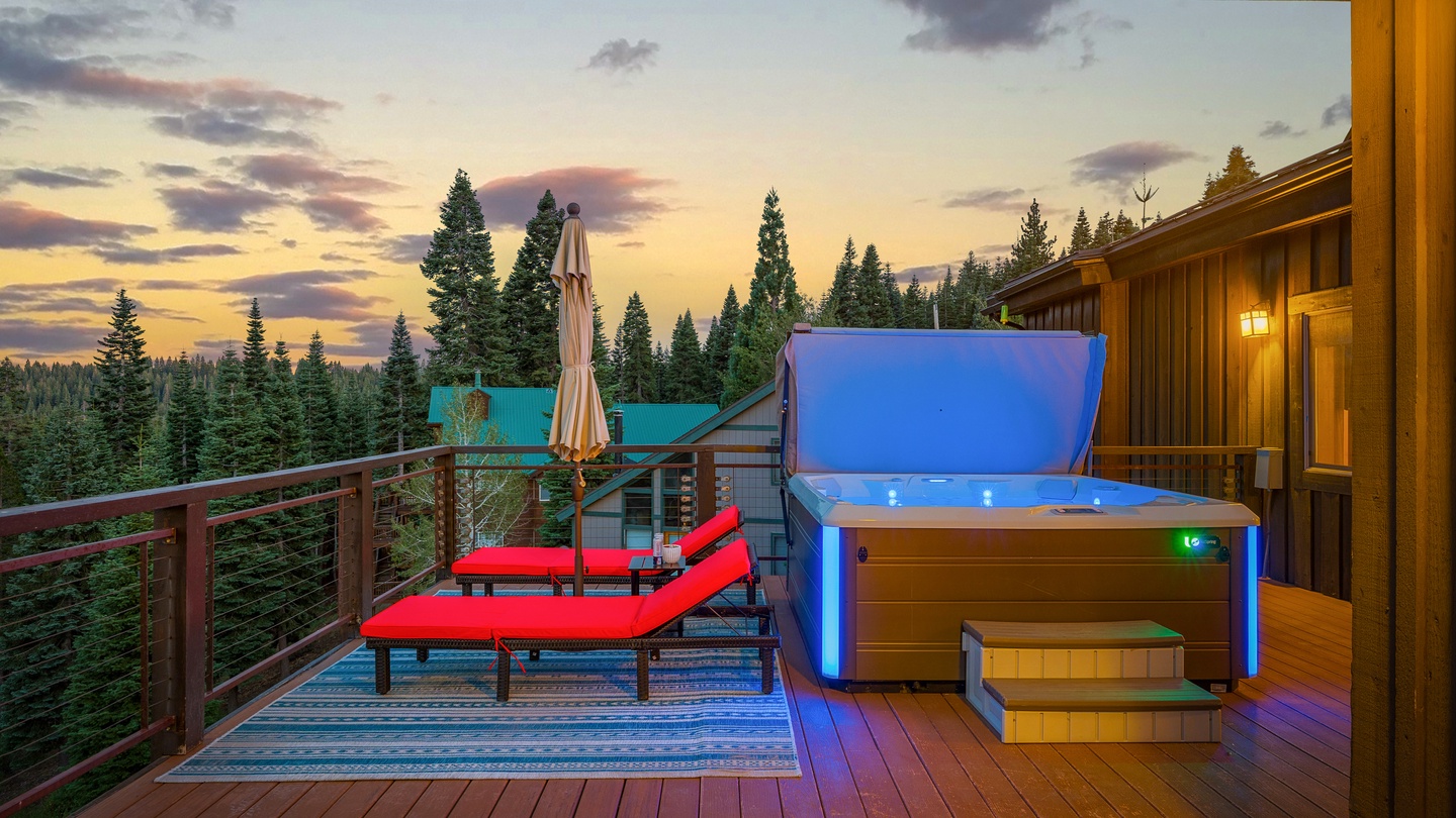 Soak under a stunning mountain sunset in your private hot tub, surrounded by towering pines and breathtaking alpine views from your deck.
