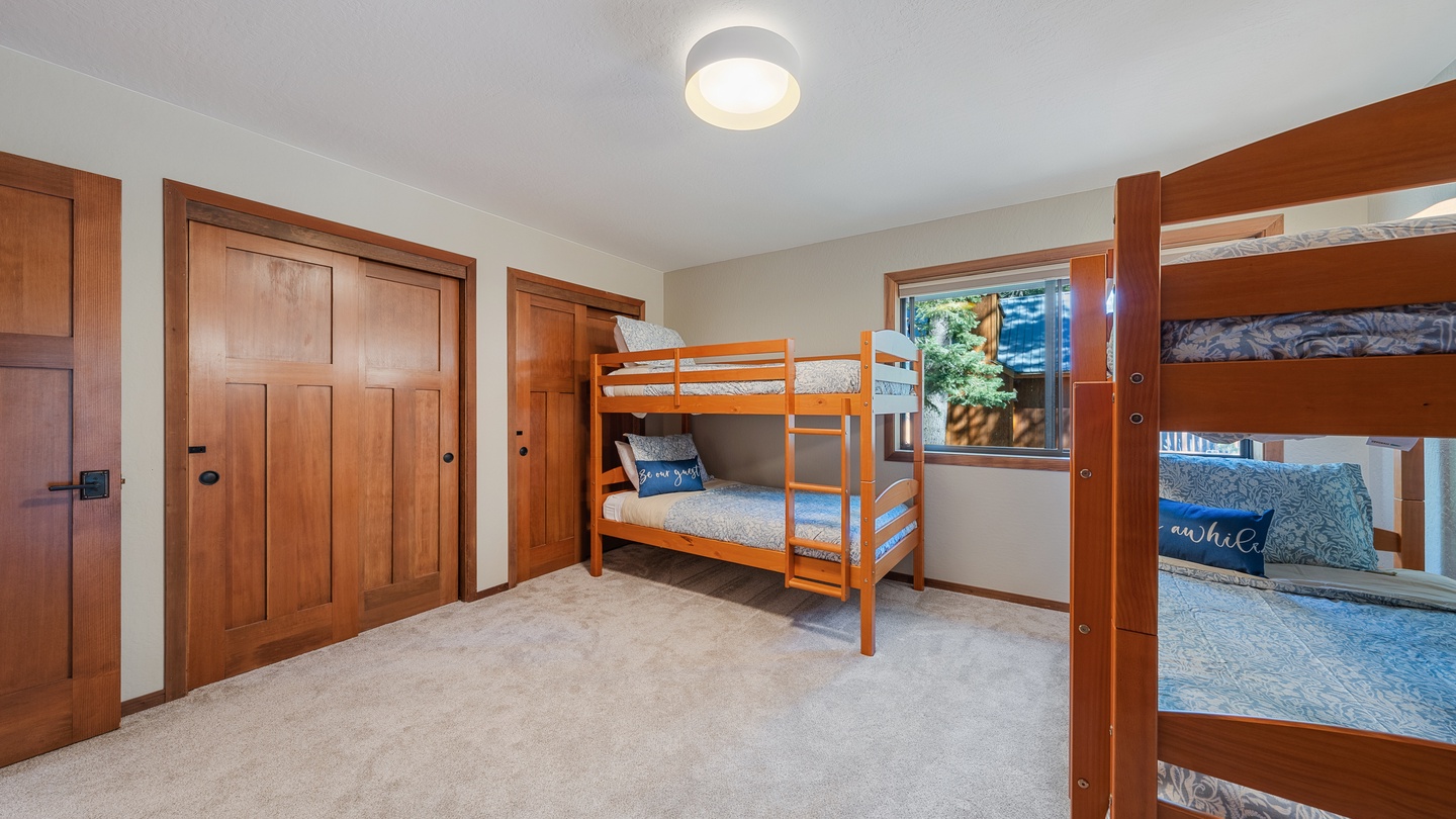 Your kids will love bunking together in this bright, cheerful bedroom with room for six. The warm wood accents and soft natural light create a cozy space for restful nights and fun mornings.