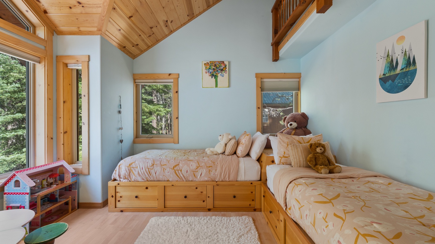 Your little ones will love this bright, cozy bedroom with charming wood accents and twin beds beneath a beautiful vaulted ceiling—perfect for restful nights after adventure-filled days.