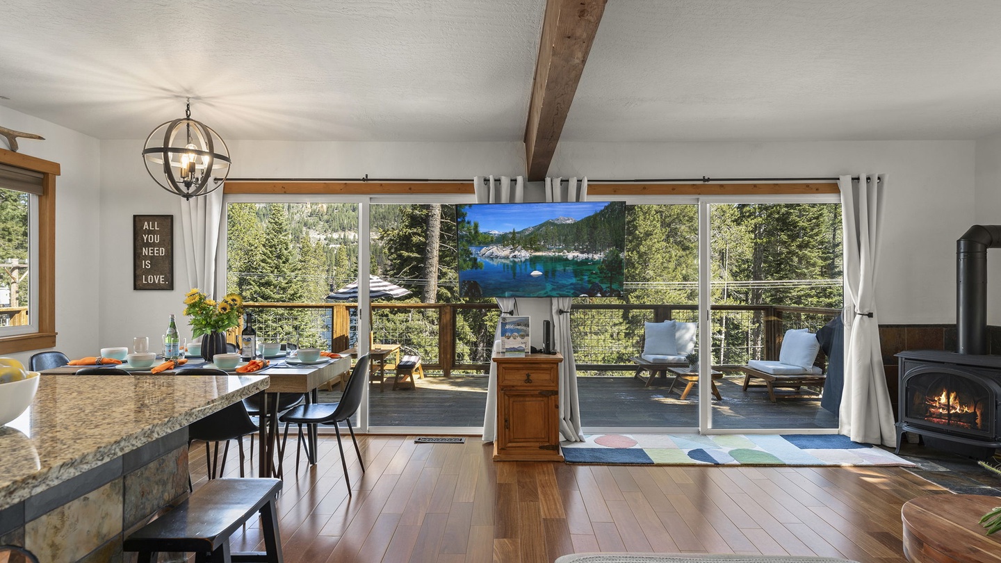 You'll love relaxing in this bright space with stunning mountain views through floor-to-ceiling windows and a cozy fireplace for evening warmth.