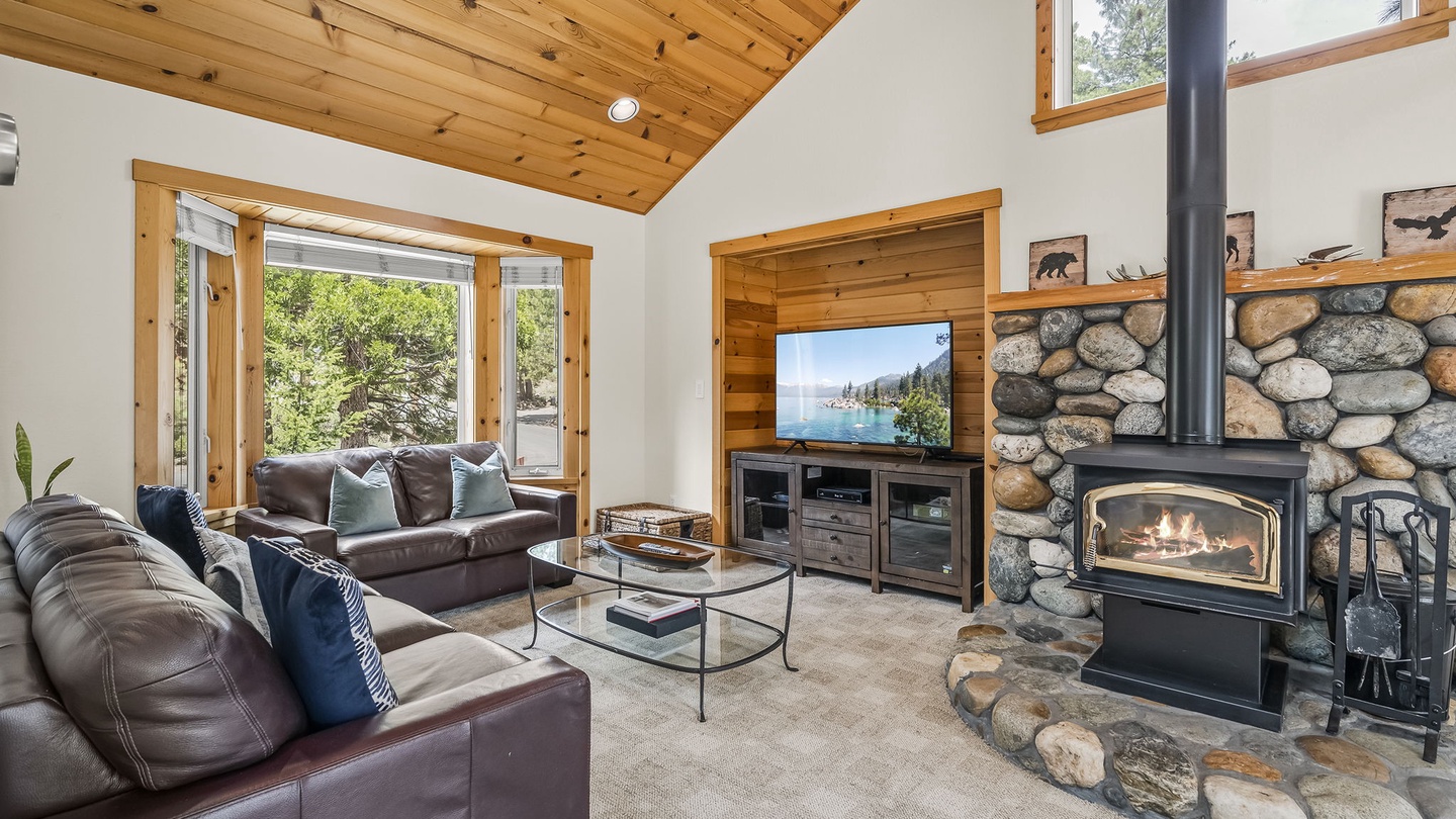 Living Room with wood-burning fireplace, and rustic river-rock hearth