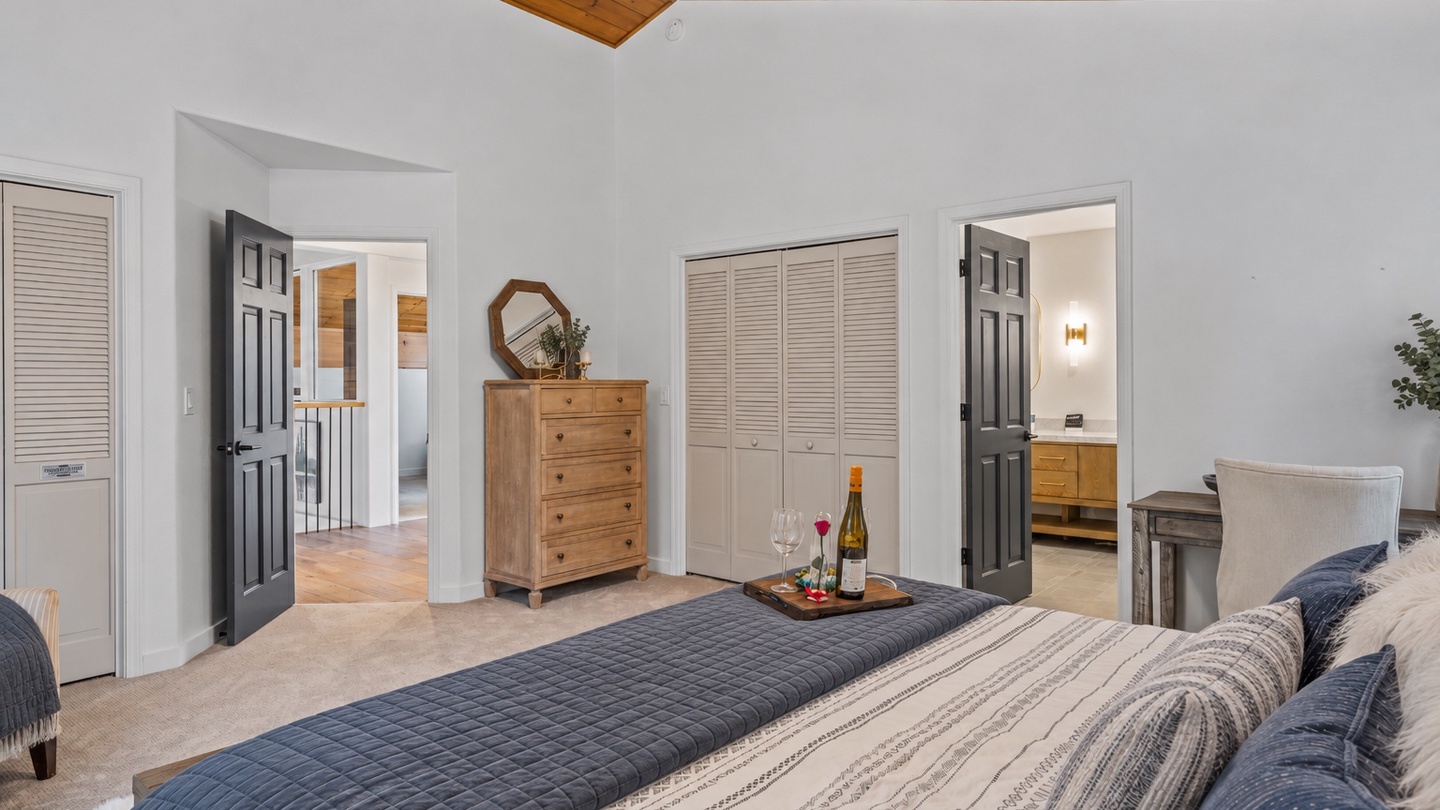 Unwind in your spacious retreat, where vaulted wood ceilings and soft natural light create the perfect blend of comfort and calm for a restful escape.