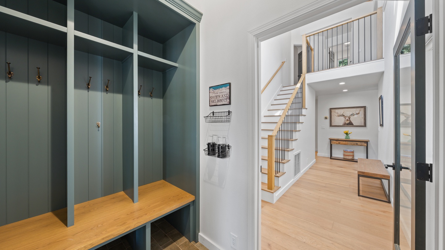 Step into your welcoming entryway with custom cubbies for all your gear and an elegant staircase that sets the tone for your stay.