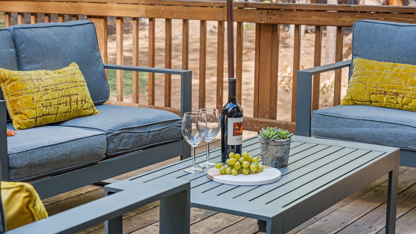 Picture yourself unwinding on your private deck with a glass of wine, surrounded by peaceful wooded views. The comfy seating and fresh outdoor air invite you to relax and savor every moment of your stay.